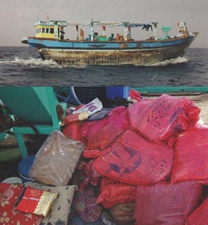 Bags of hashish, below, found on the fishing boat, above, in the Arabian Sea in December 2003.
